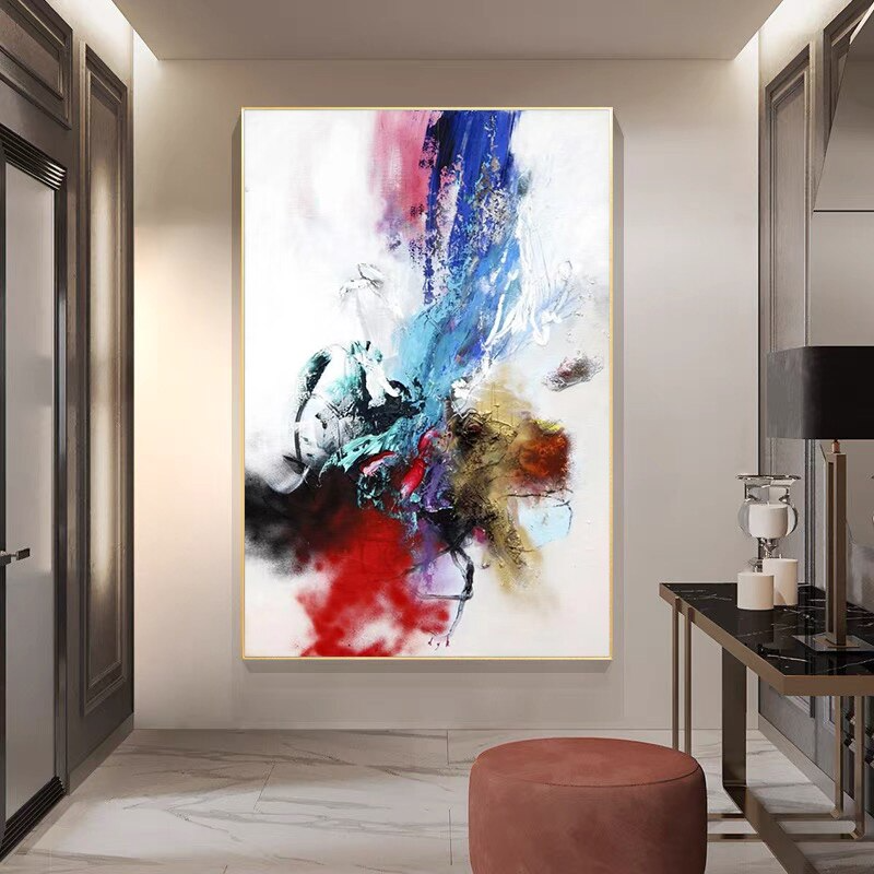 a painting hanging on a wall in a room