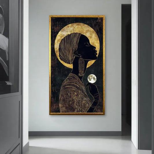 a large framed artwork depicting a woman with a headdress and a moon in her hand, hanging on a wall in a hallway.