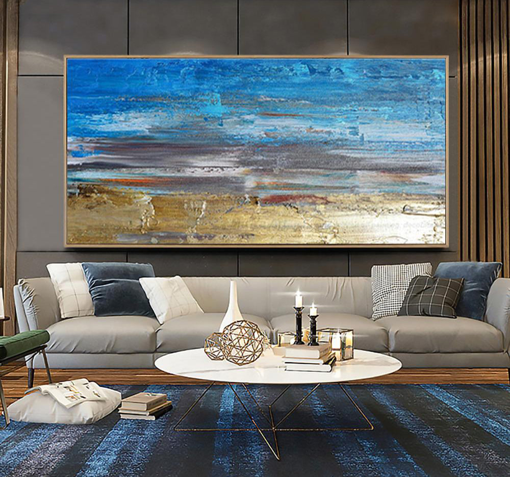 a living room filled with furniture and a large painting on the wall