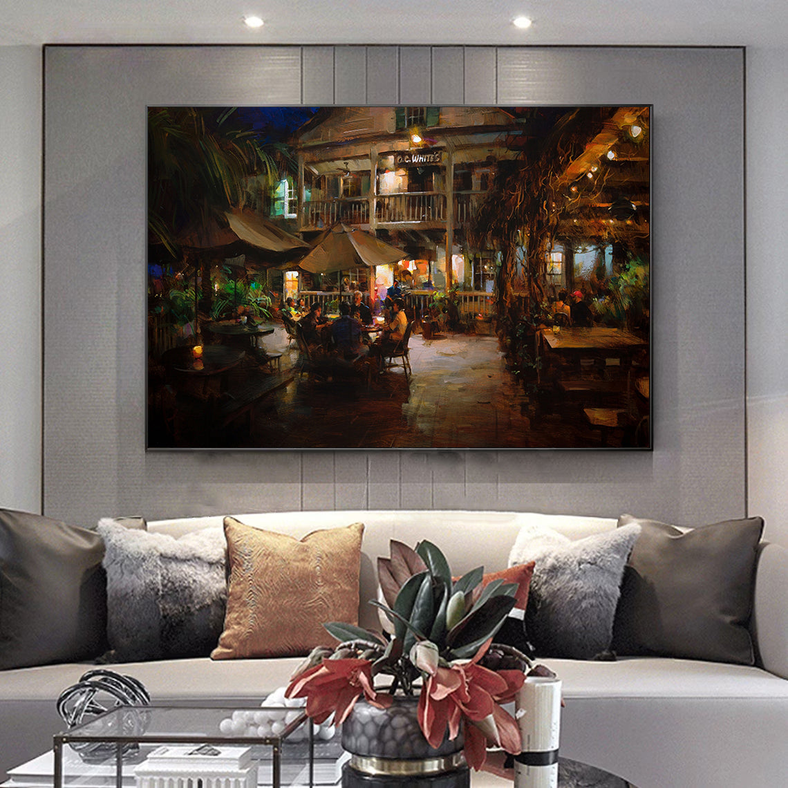 a living room with a couch and a painting on the wall