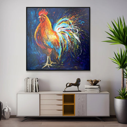 a vibrant painting of a rooster, which is hanging on a wall above a white cabinet with drawers. The painting is surrounded by various decorative items, including a potted plant, a sculpture, and a stack of books.