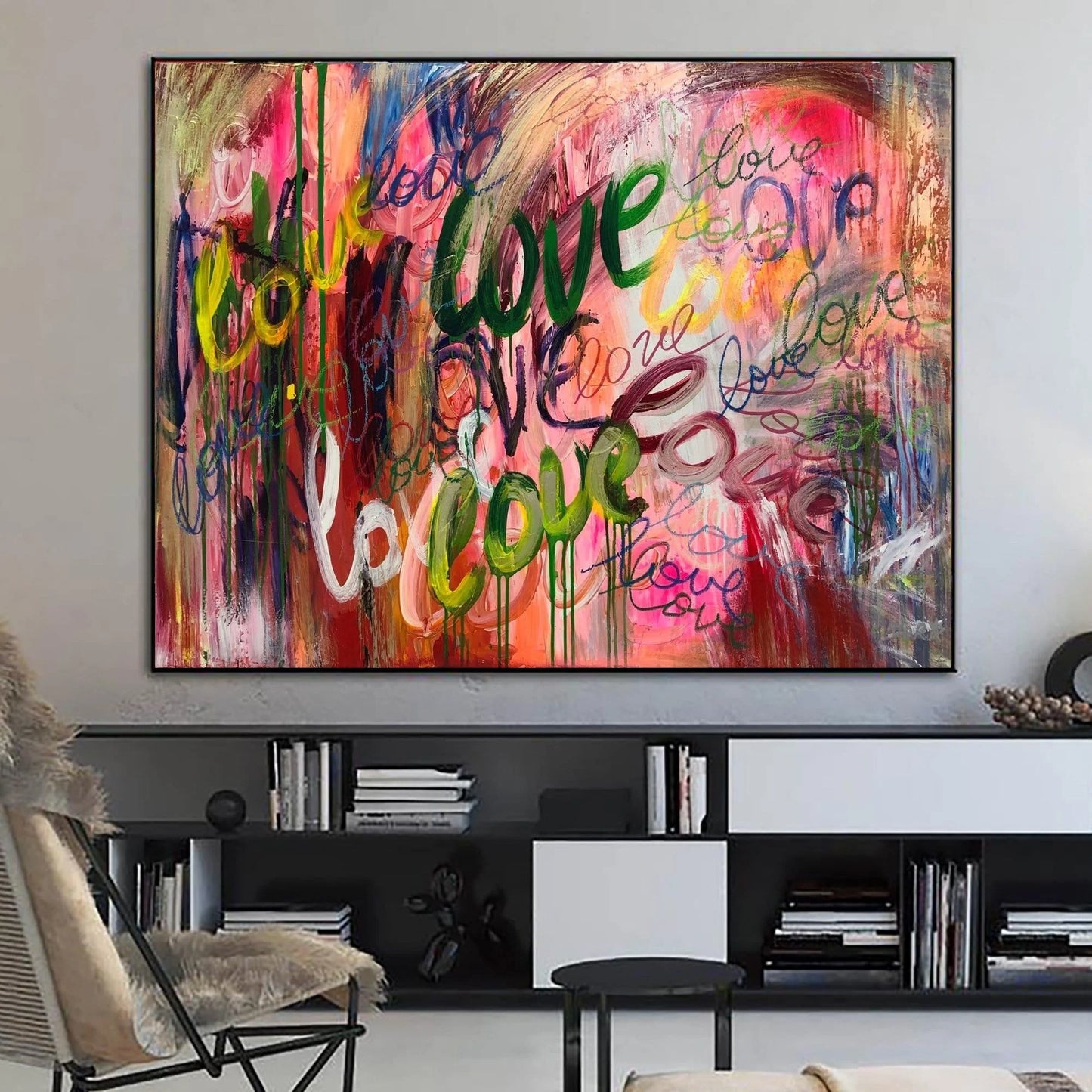 a large, colorful abstract painting hanging on a wall in a living room.