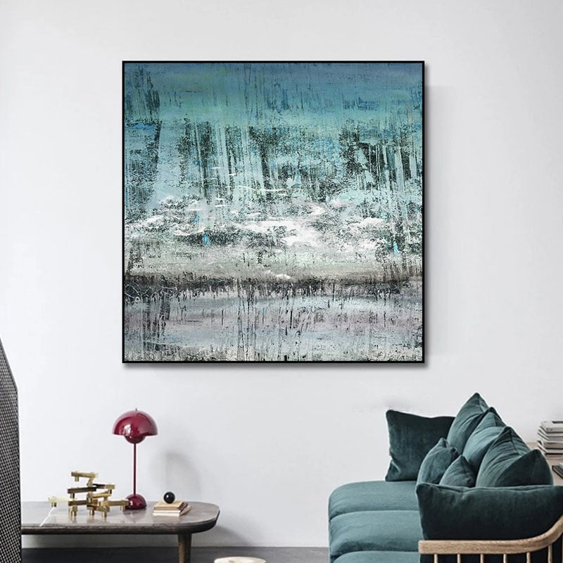 a living room filled with furniture and a painting on the wall