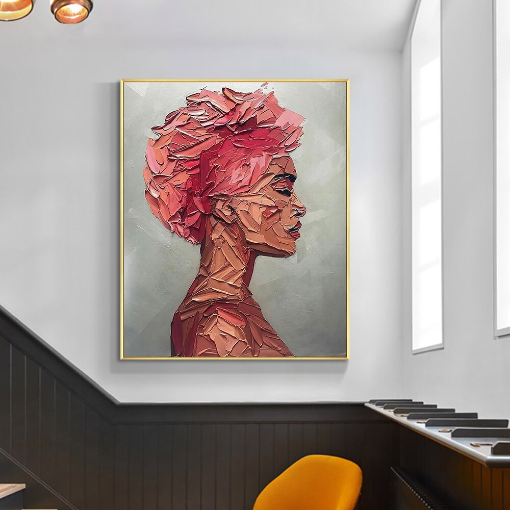 a painting of a woman's head on a wall