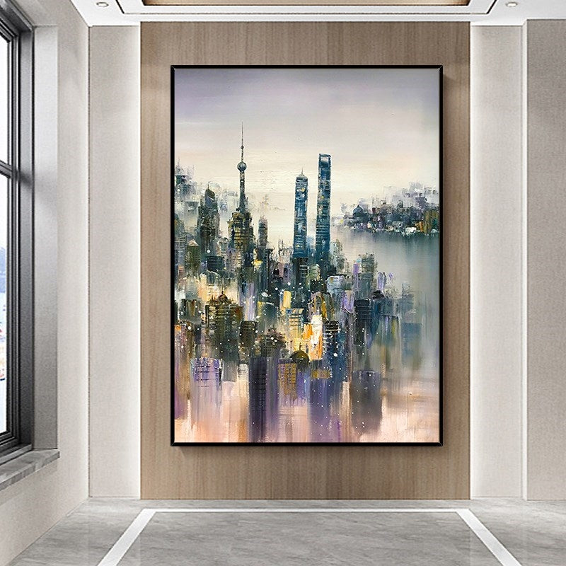 a painting of a cityscape is hanging on a wall