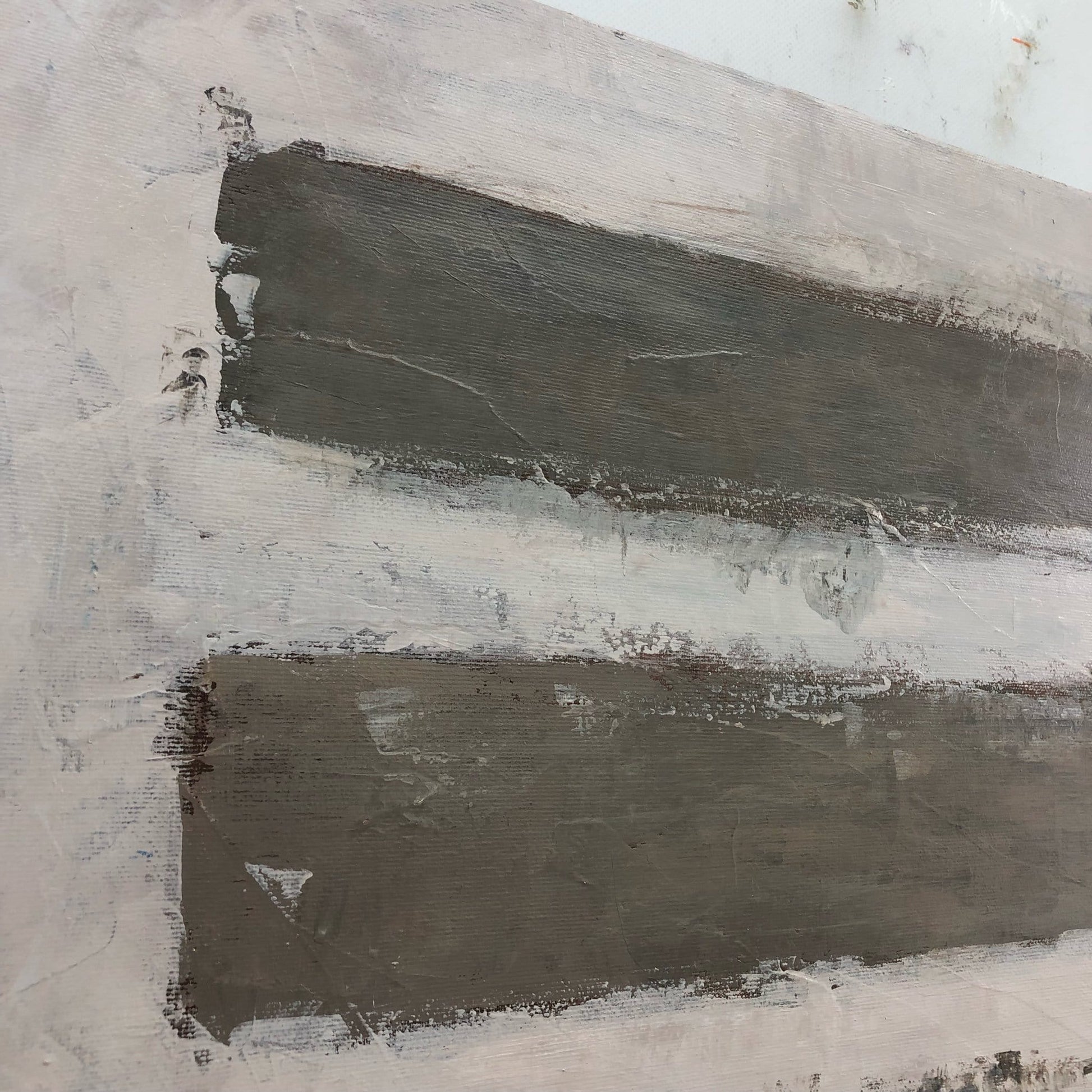The image is a close-up of a painting with two horizontal stripes of varying shades of gray, creating a sense of depth and texture.