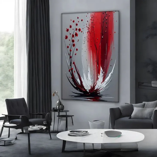 a modern living room with a large abstract painting on the wall, a gray sofa, a black chair, and a white coffee table.