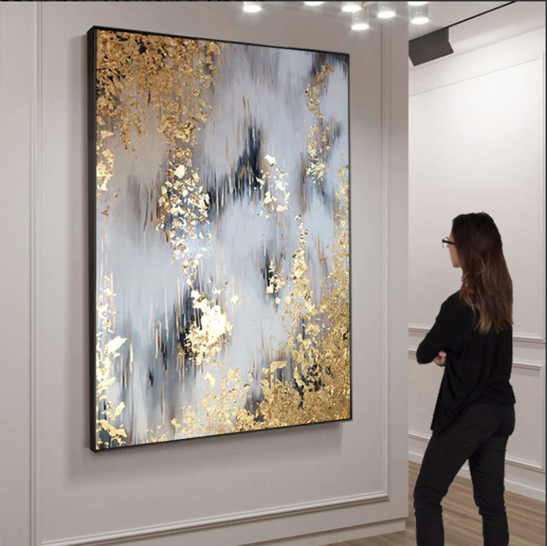 a woman standing in front of a large painting