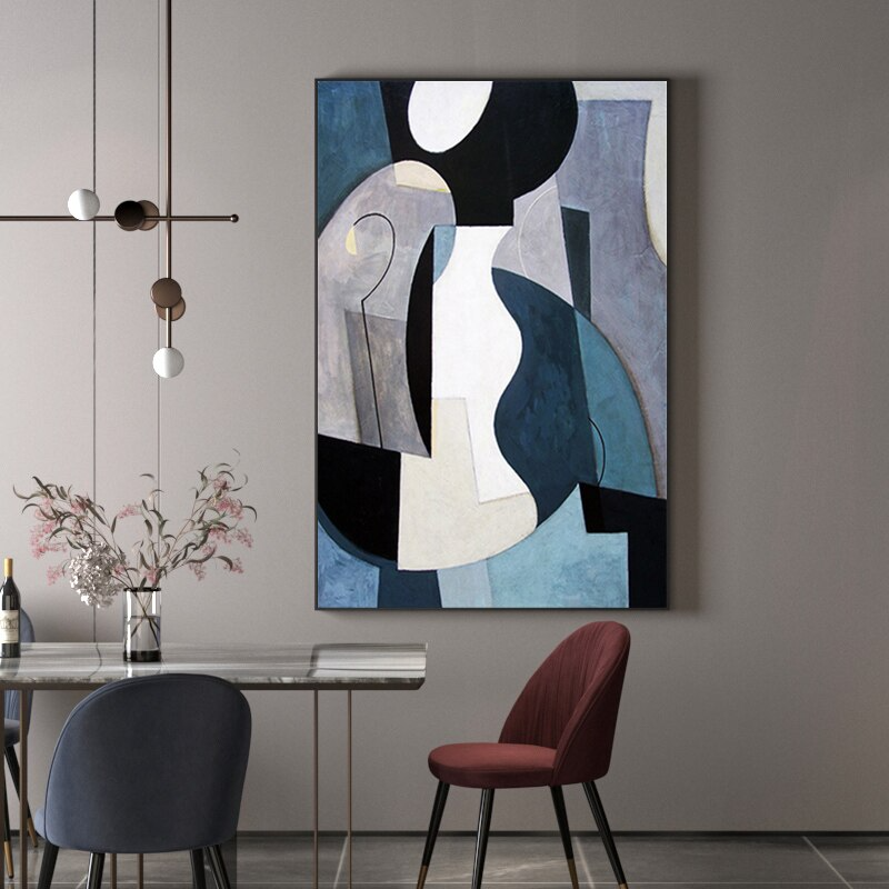 a painting hanging on a wall above a dining room table