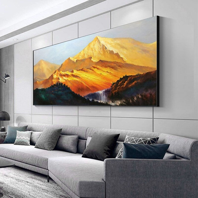 a living room with a couch and a painting on the wall