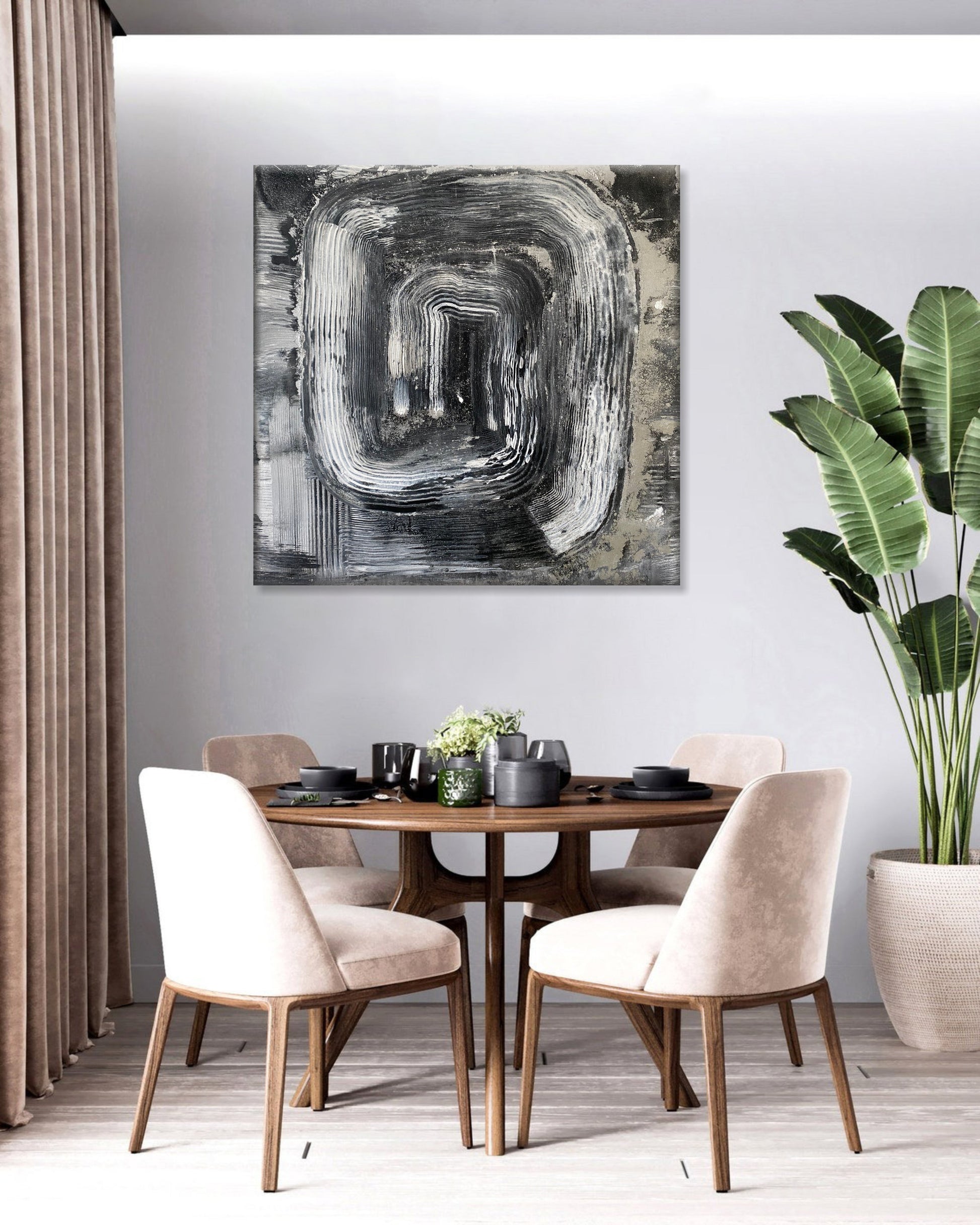 a dining room table with chairs and a painting on the wall