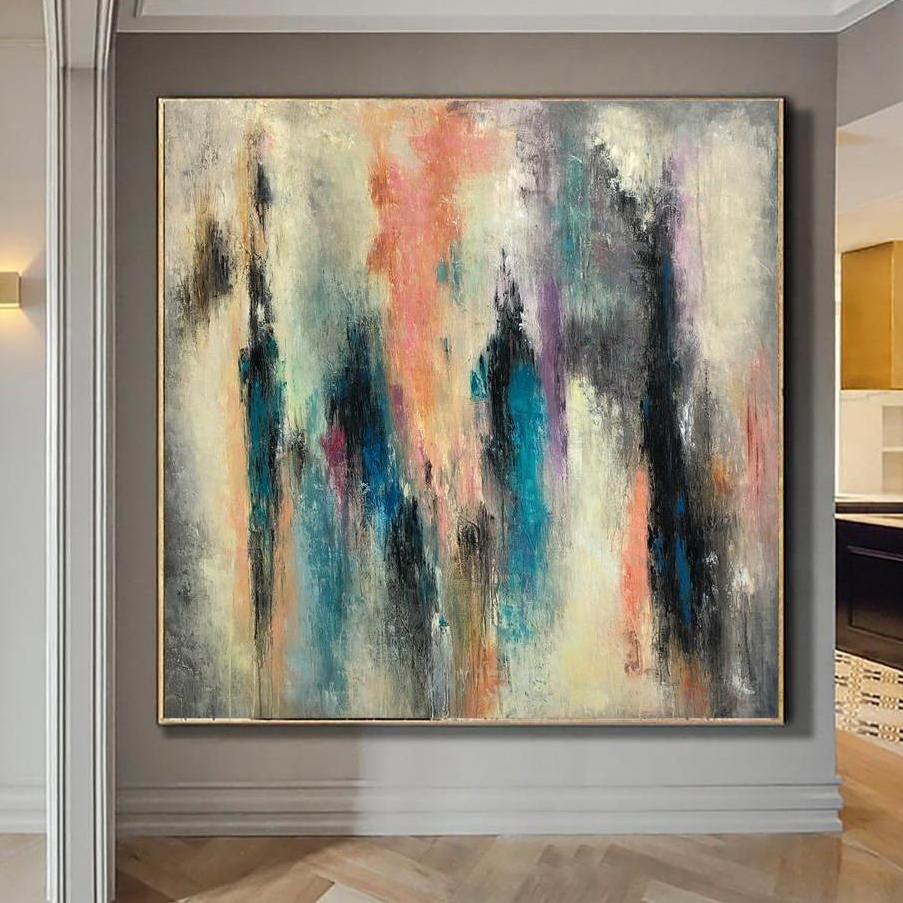 a large abstract painting hanging on a wall in a room.
