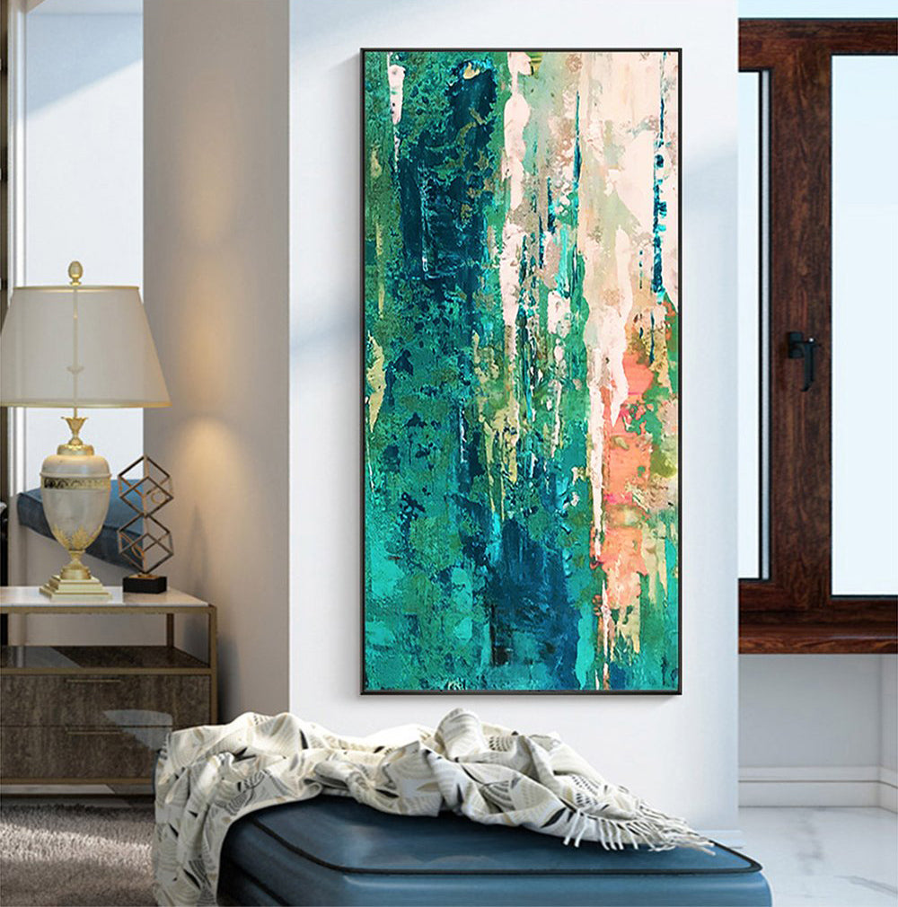 a painting hanging on a wall in a living room