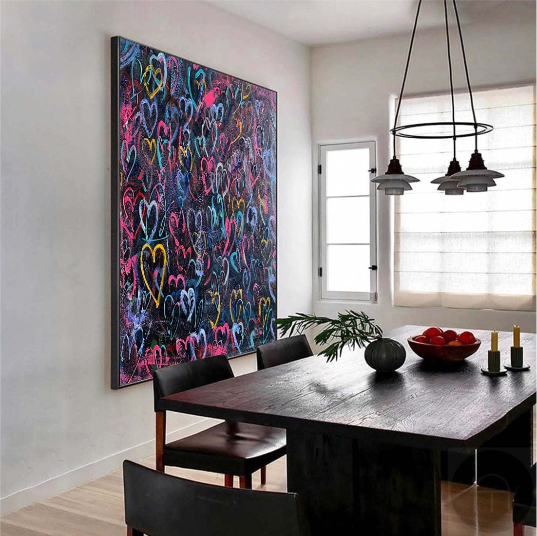 a dining room with a large painting on the wall