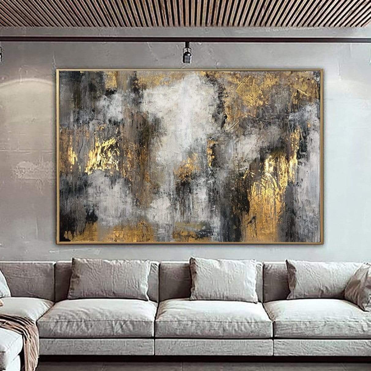 a living room with a couch and a painting on the wall