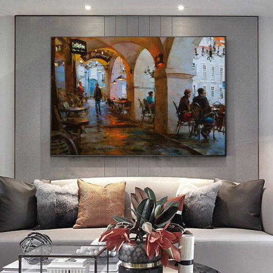 a living room with a couch and a painting on the wall