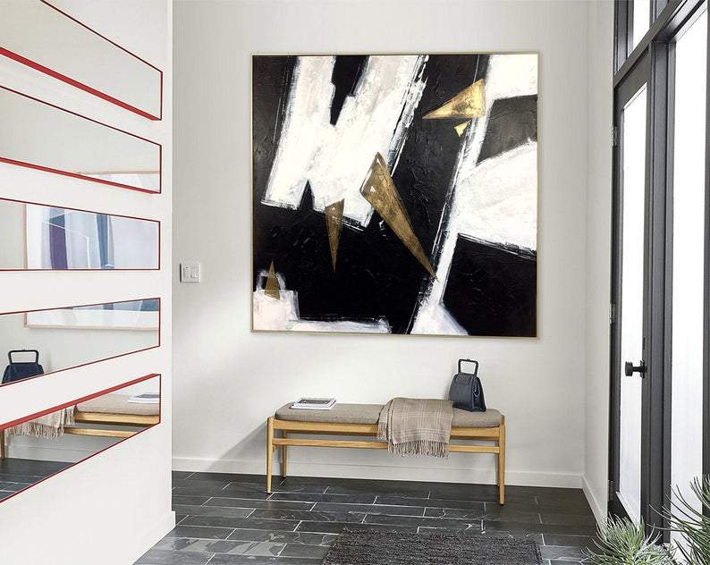 a painting hanging on the wall of a living room