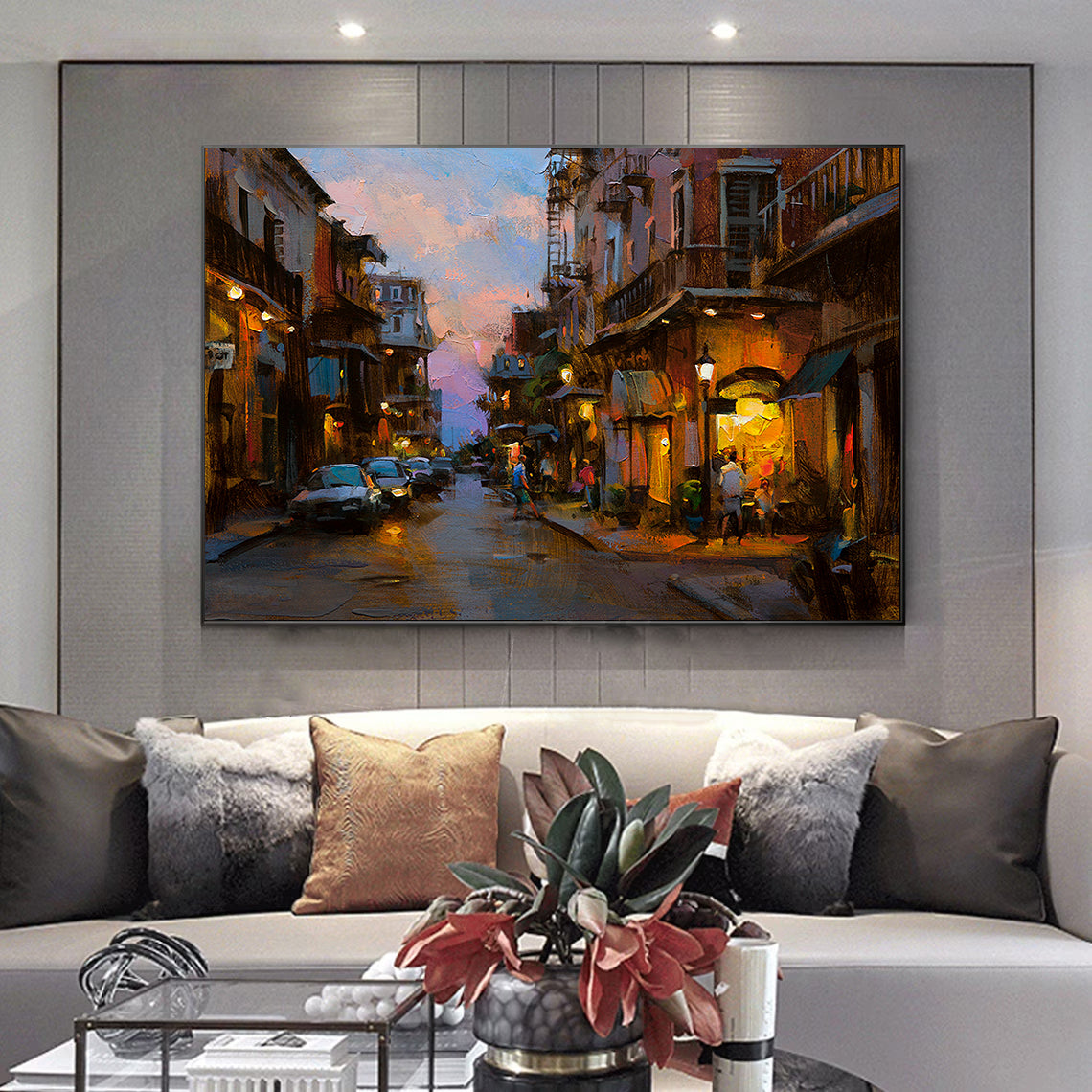 a living room with a couch and a painting on the wall