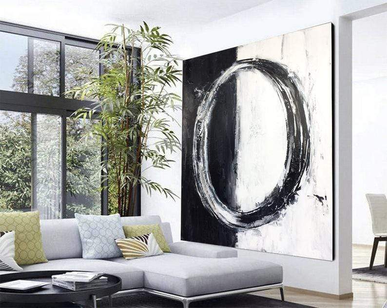 a living room with a large painting on the wall