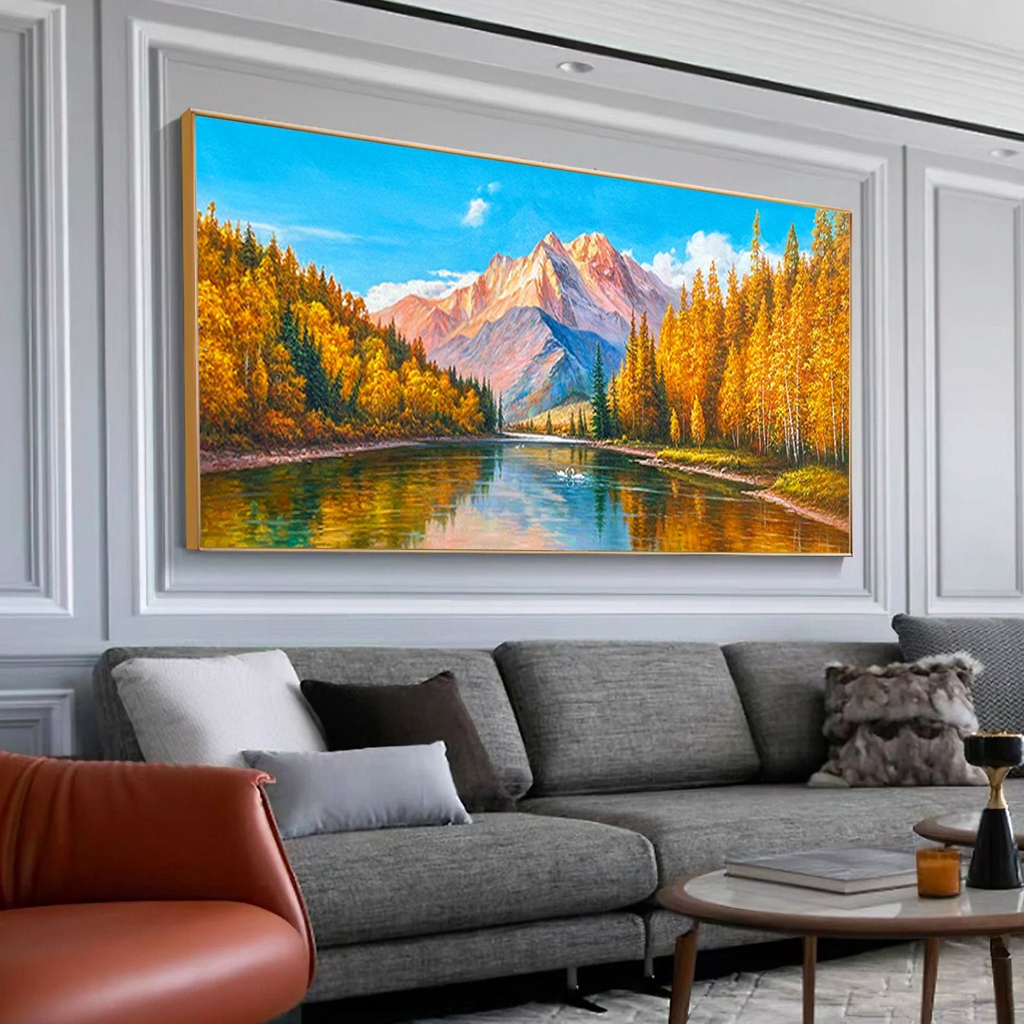 a living room with a couch and a painting on the wall