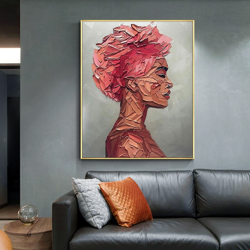 a living room with a couch and a painting on the wall