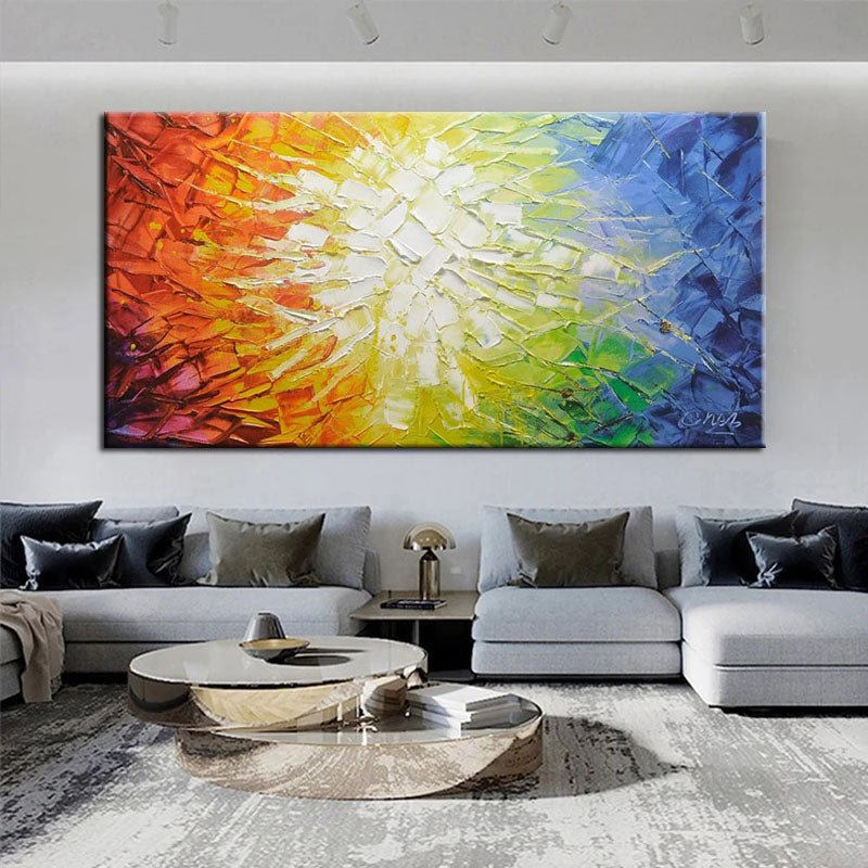 a living room with a large painting on the wall