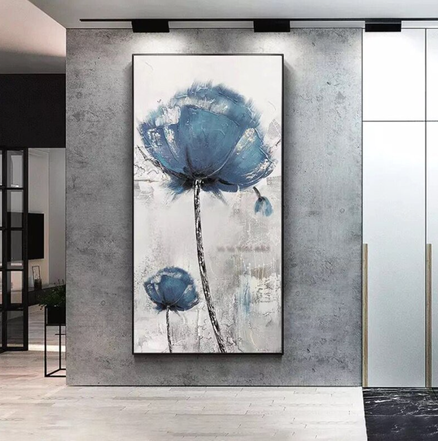 a painting of a blue flower on a wall