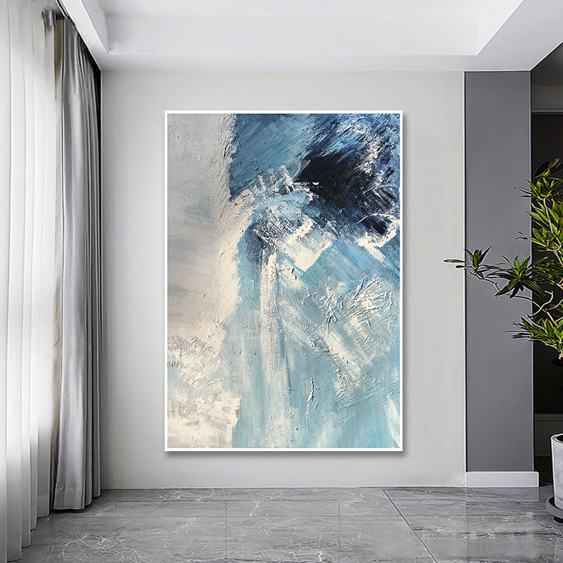 a painting hanging on a wall in a living room