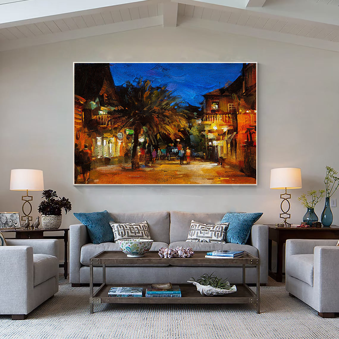 a living room filled with furniture and a painting on the wall