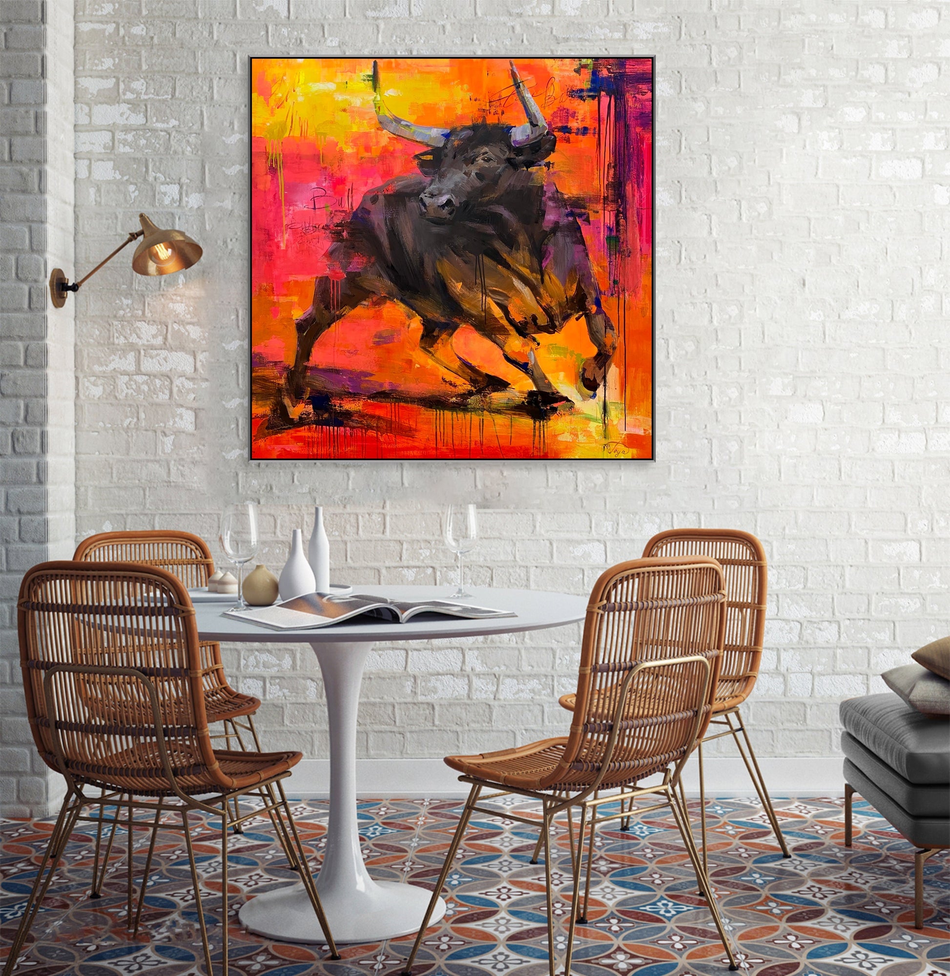 a painting of a bull on a wall above a table