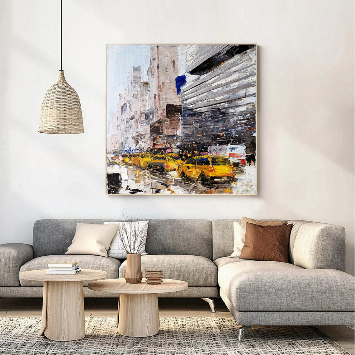 a living room filled with furniture and a painting on the wall