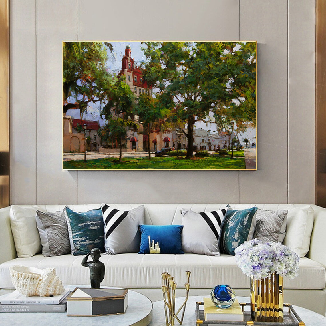 a living room filled with furniture and a painting on the wall