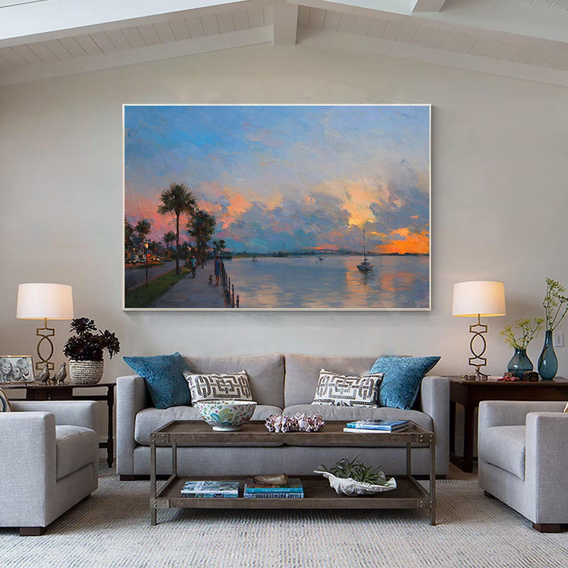 a living room filled with furniture and a painting on the wall