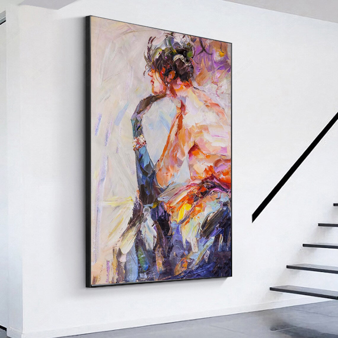 a painting hanging on a wall next to a stair case