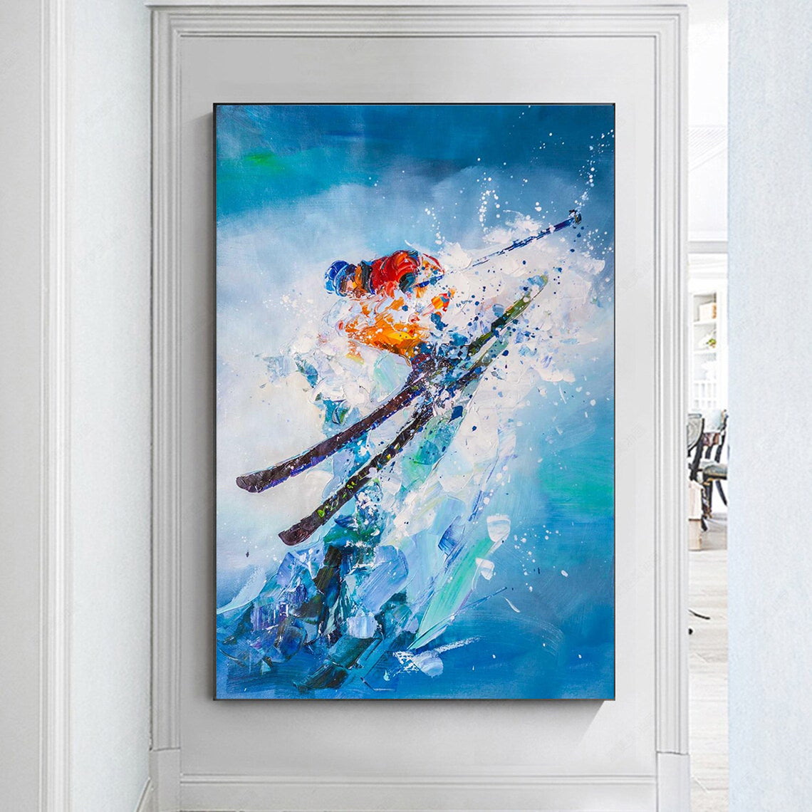 a painting of a skier is hanging on a wall