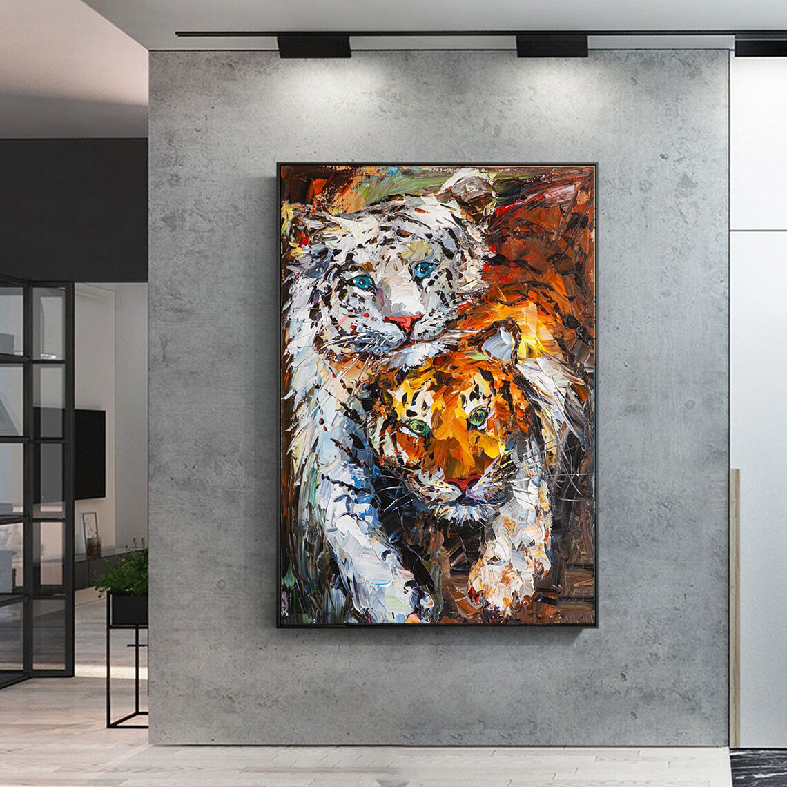 a painting of two tigers on a wall