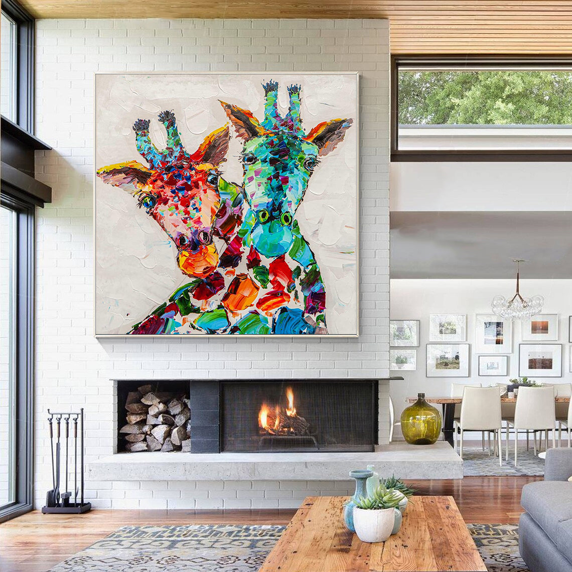 a living room with a fireplace and a painting on the wall