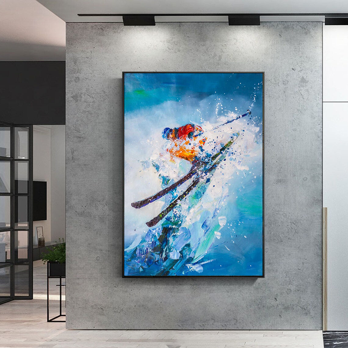 a painting of a skier is hanging on a wall