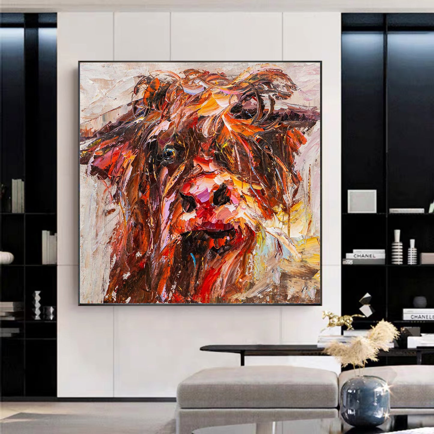 a painting of a cow in a living room