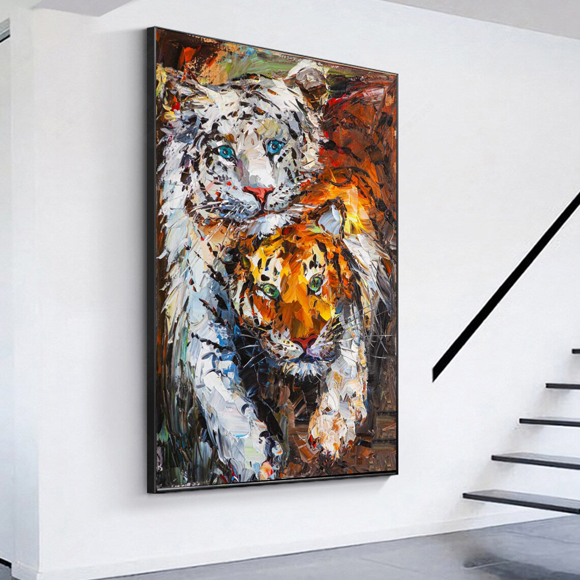 a painting of two tigers on a white wall