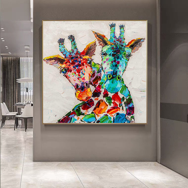 a painting of two giraffes on a wall