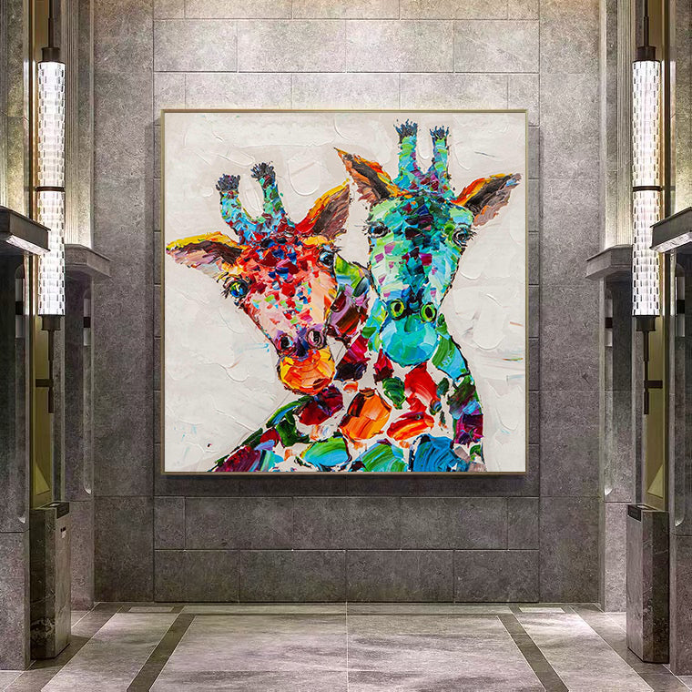 a painting of two giraffes on a wall