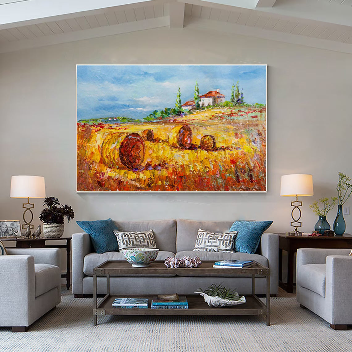 a living room filled with furniture and a painting on the wall