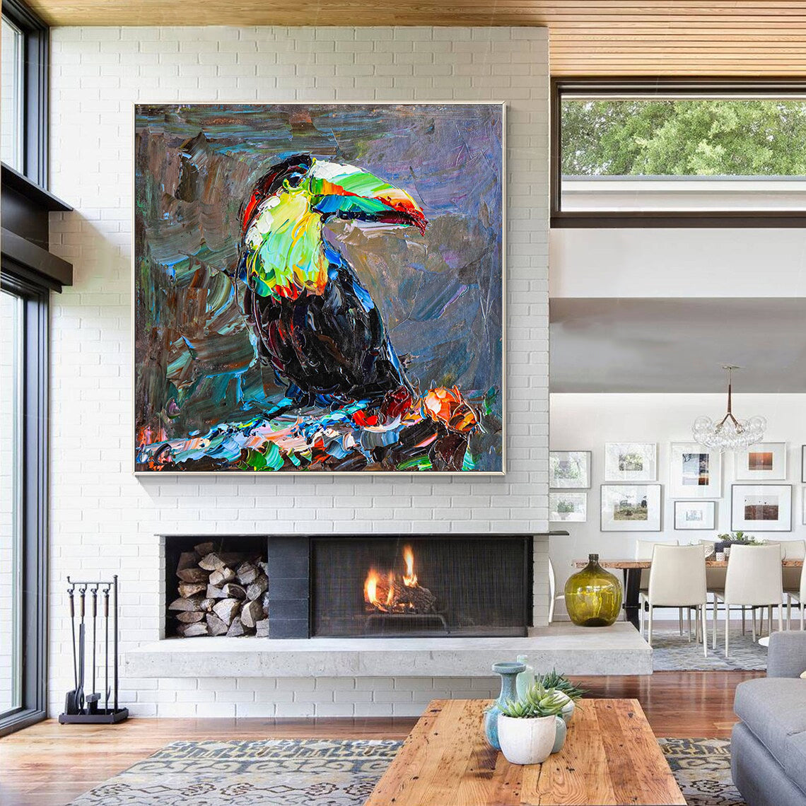 a living room with a large painting of a toucan on the wall