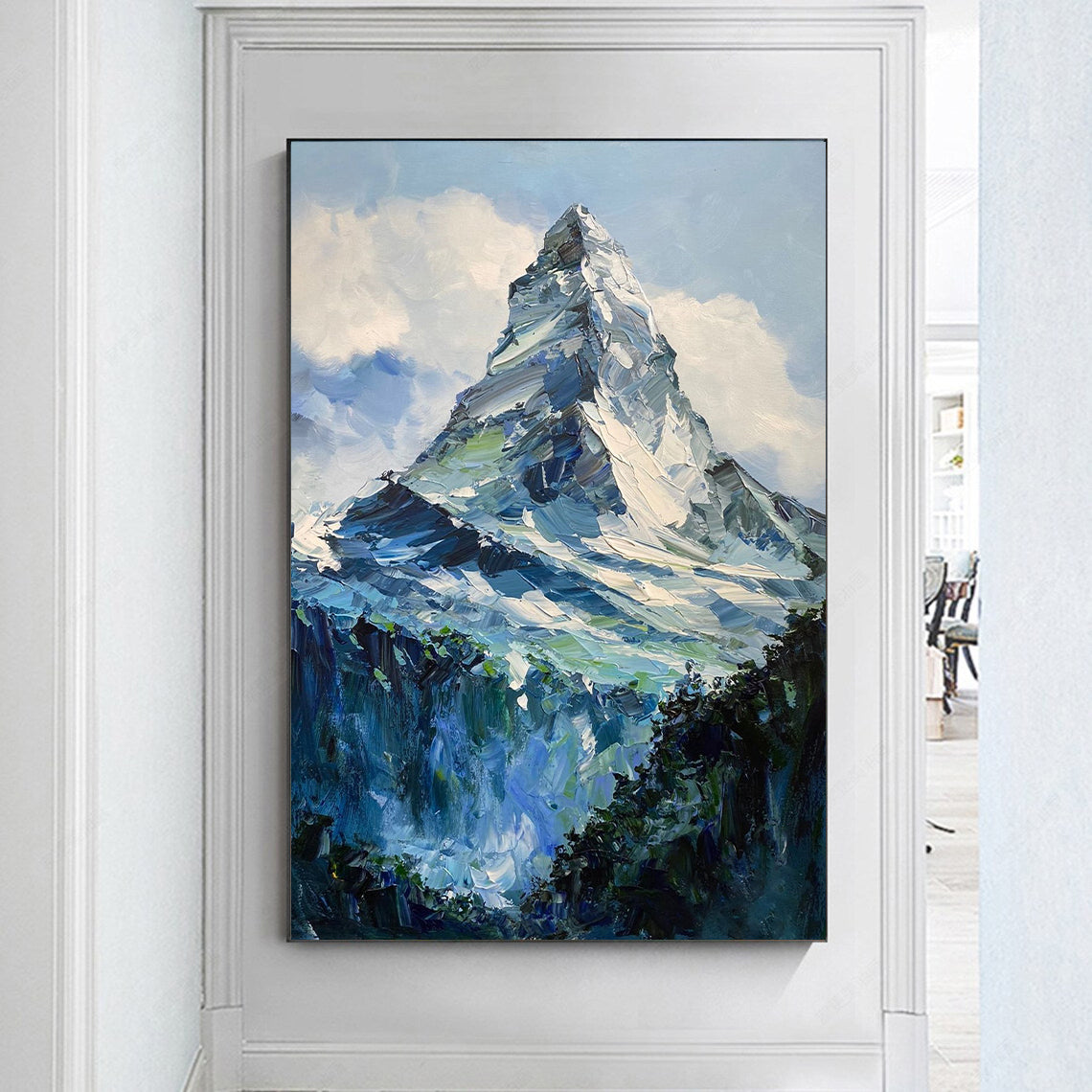 a painting of a mountain in a frame