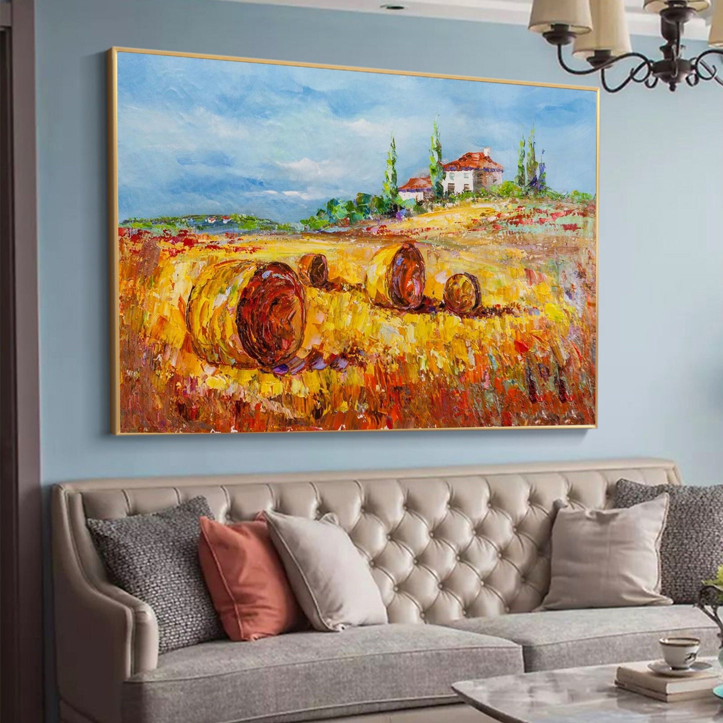 a living room with a couch and a painting on the wall